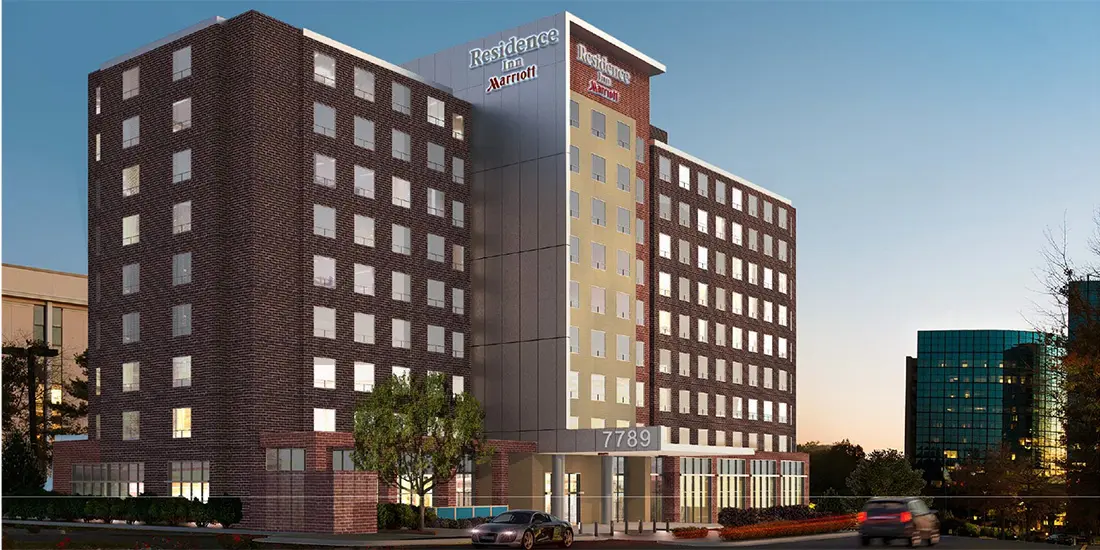 A rendering of the front entrance to a hotel.