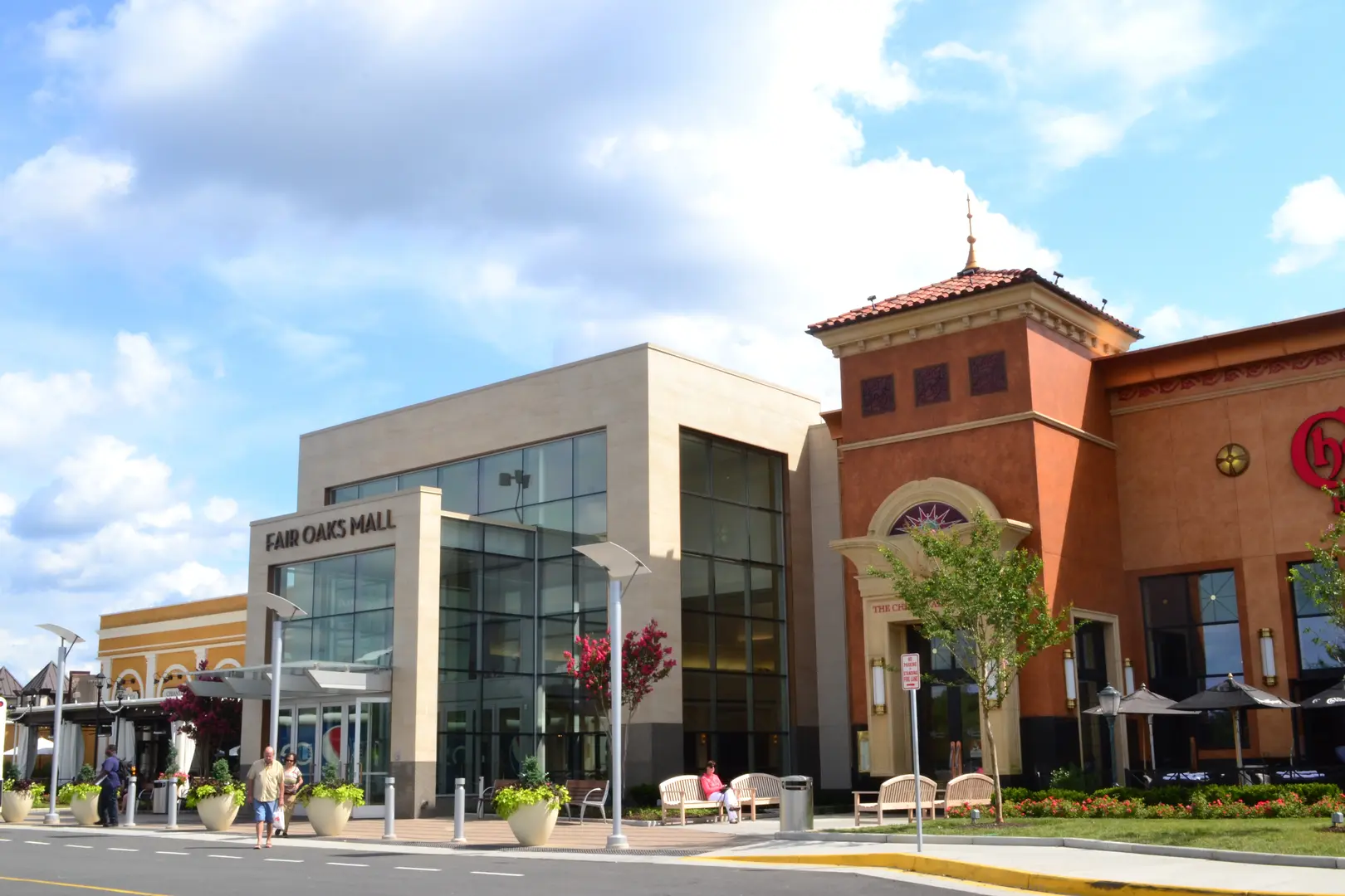 A building with two windows and a clock tower.